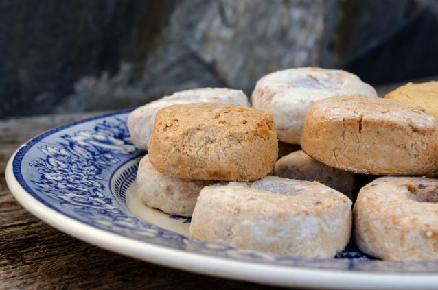 Detail on a plate with christmas sweets and confectionaries mousse polvorones